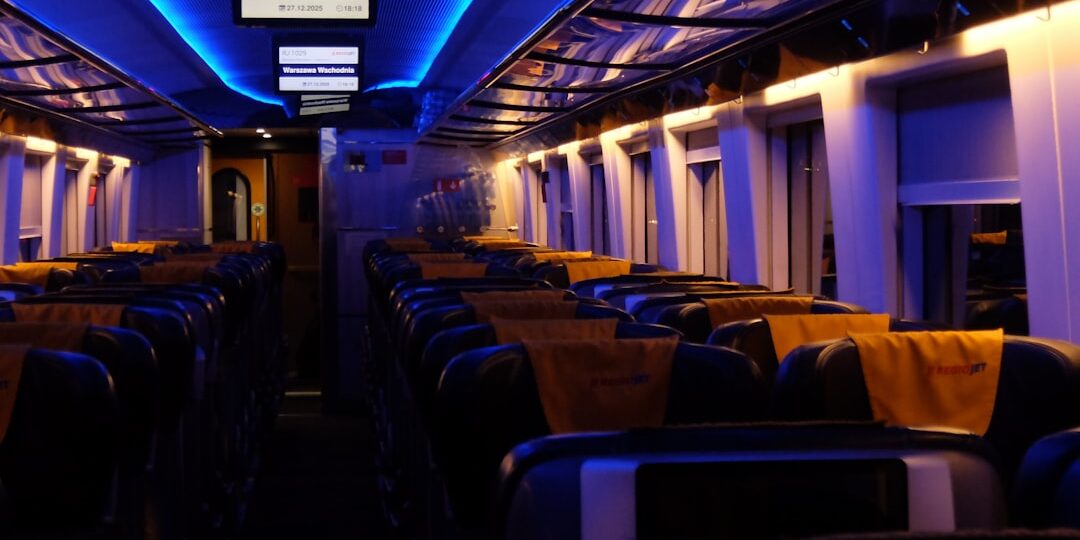Empty train carriage with blue and yellow lighting