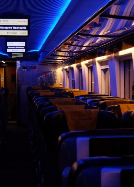 Empty train carriage with blue and yellow lighting